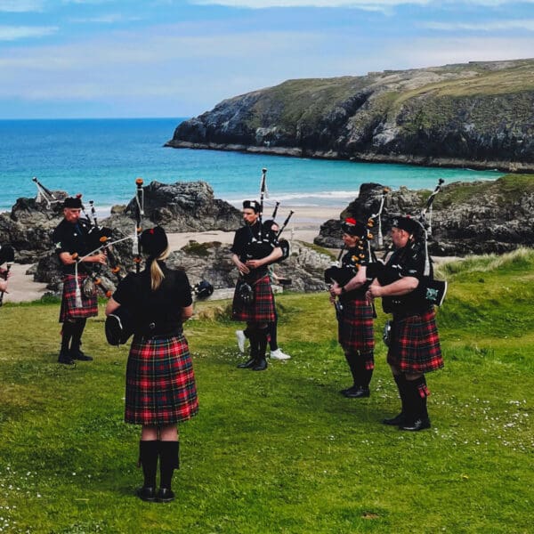 Pipe Band at Sango Bay in Durness by Niamh Ross