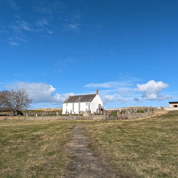 Strathnaver Museum viewed from a distanc over a field