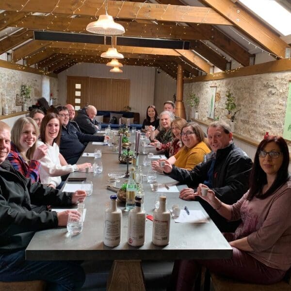People tasting drinks at Dunnet Bay Distillery.
