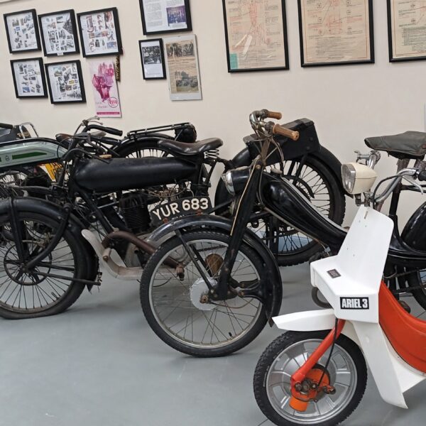 A display of vintage bikes with descriptions