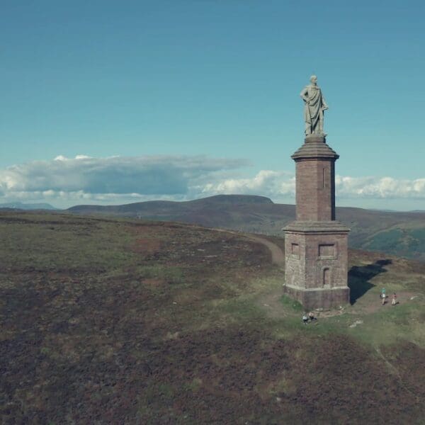 Aerial view of The Mannie, viewed from the back with more hills in the far distance