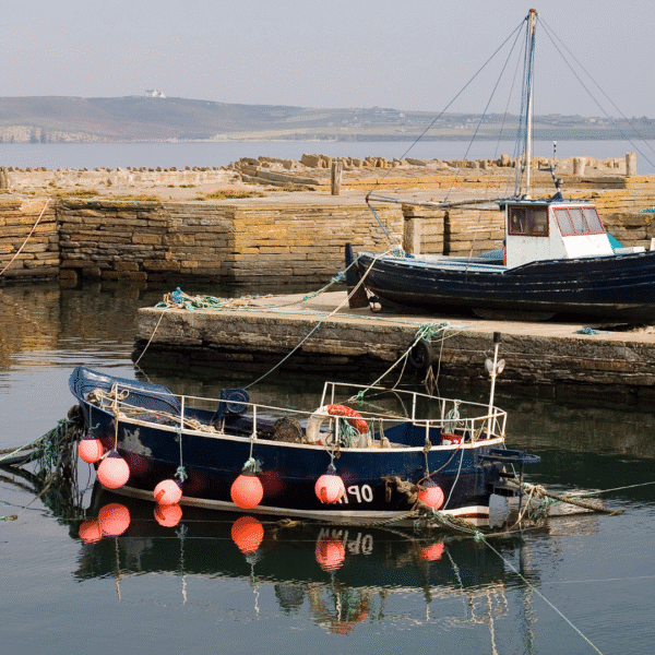 Two boats in Castletown harbour along the Flagstone trail