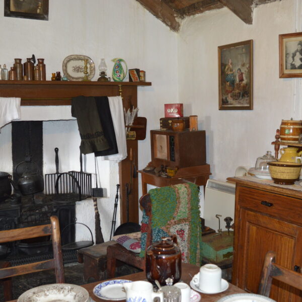 The inside of the Laidhay Croft Museum, showing the restored and preserved interior decorations of the building.