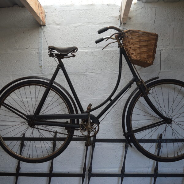 An old bike hung from the rafters inside the Croft Museum.