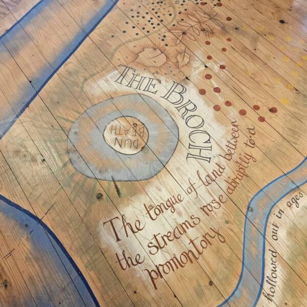 A map featuring a broch, painted on the floor of the Dunbeath Heritage Museum. Caithness.