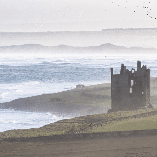 Keiss Castle veiwed from a distance on a foggy day