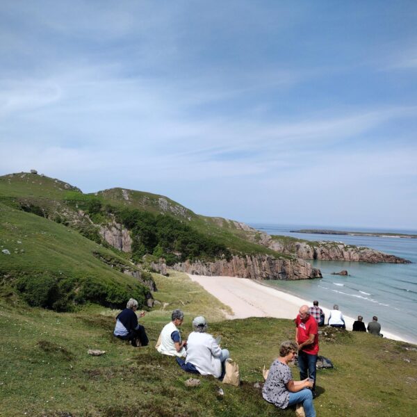 Robbie Mac Tours group overlooking a beach