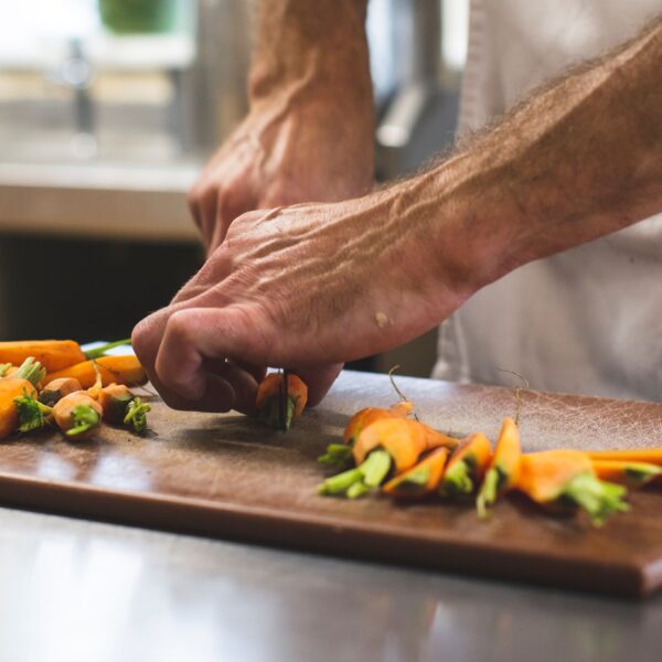 Head Chef preparing food in the Glebe Kitchen at Eddrachilles Hotel, North West Sutherland